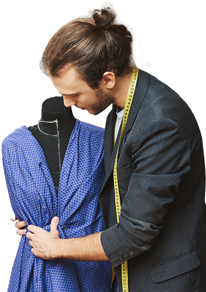 Tailor measuring and cutting fabric for custom stitching.