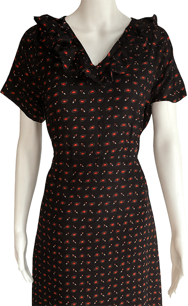 Women's black midi dress with a floral print displayed on a mannequin