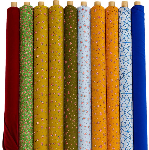 Colorful printed fabric rolls in different patterns, suitable for custom tailoring and dressmaking.